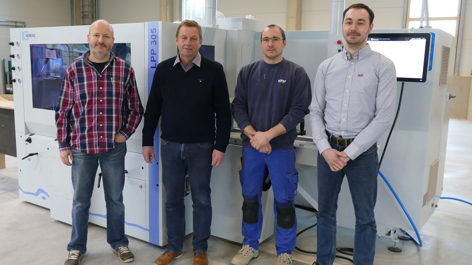 From left to right: Volker Pfefferle (Head of Work Preparation for wood and wood/aluminum), Managing Director Jürgen Nestle, Carsten Rosner (Head of Production for the wood department), Johannes Lang (Product Manager for planing machines)