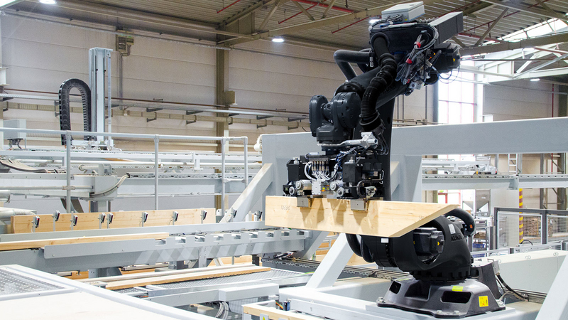 Le robot insère les montants dans les ossatures avec une précision maximale. Le robot insère les montants dans les ossatures avec une précision maximale.