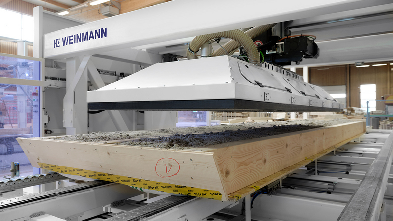 Automated blow-in of wood fibre insulation material with WEINMANN multifunction bridge