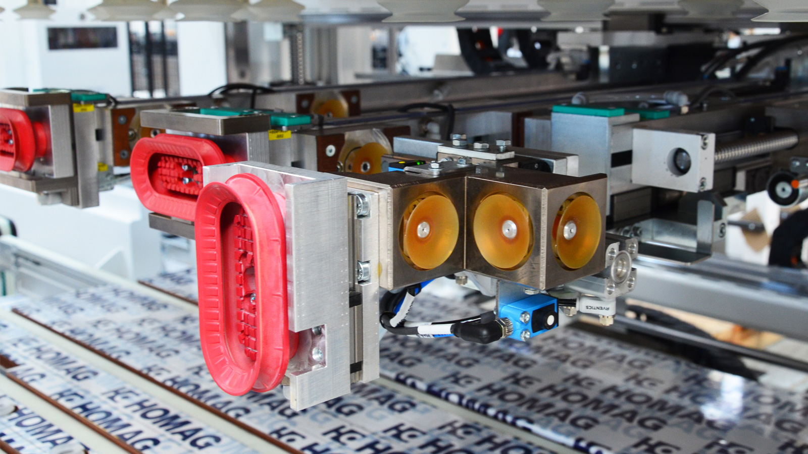 The vacuum holding arms make it easier to insert the shelves by holding them vertically.