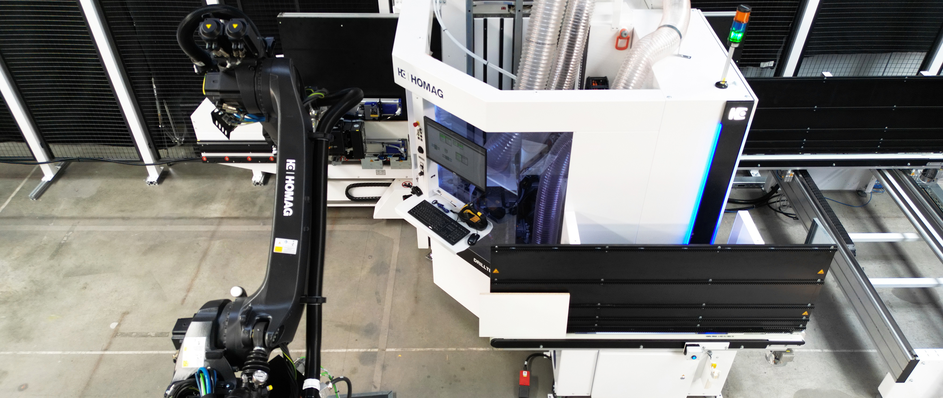 Robot Integration FEEDBOT D-310 with vertical CNC processing center DRILLTEQ V-310